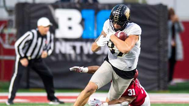 Purdue's Payne Durham (87) is tackled by Indiana's Bryant Fitzgerald (31) during the second half of the Indiana versus Purdue football game at Memorial Stadium on Saturday, Nov. 26, 2022.